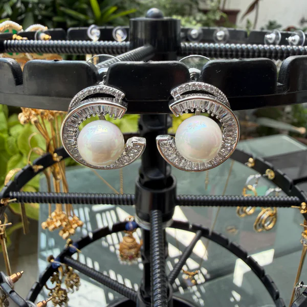 Pearl Seashell Studs - Earrings from BLINGARI luxury Indian fashion collection
