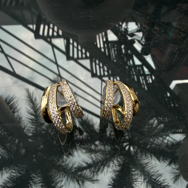 Triple Seashell Studs - Earrings from BLINGARI luxury Indian fashion collection