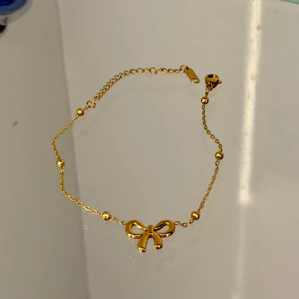 Golden Bow Bracelet - Bangles from BLINGARI luxury Indian fashion collection