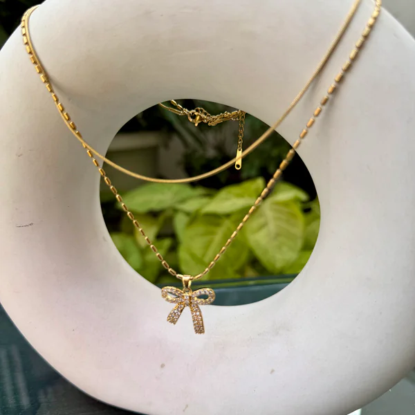 Crystal Bow Gold Chain - Necklaces from BLINGARI luxury Indian fashion collection